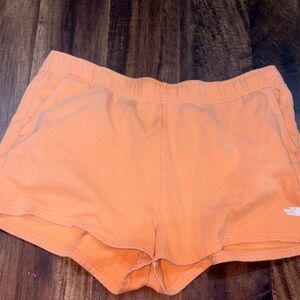 The North Face Bright Orange Fleece Shorts with Logo Tag
